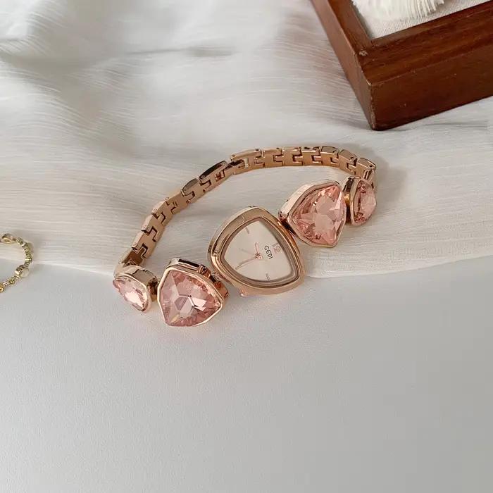 Montre à quartz rose pour femmes, cadran de forme irrégulière, légère, de luxe, tempérament, bracele