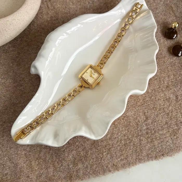 Montre vintage dorée pour femme avec bracelet chaîne