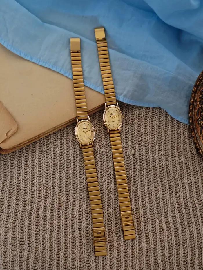 1 nouvelle montre à quartz dorée pour femme, style rétro luxueux, boîtier ovale et bracelet en cuir, montre élégante et polyvalente pour femme.