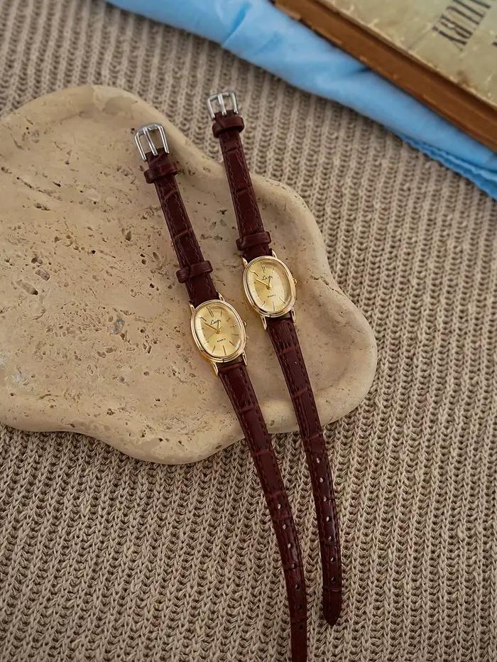 1 nouvelle montre à quartz dorée pour femme, style rétro luxueux, boîtier ovale et bracelet en cuir, montre élégante et polyvalente pour femme.