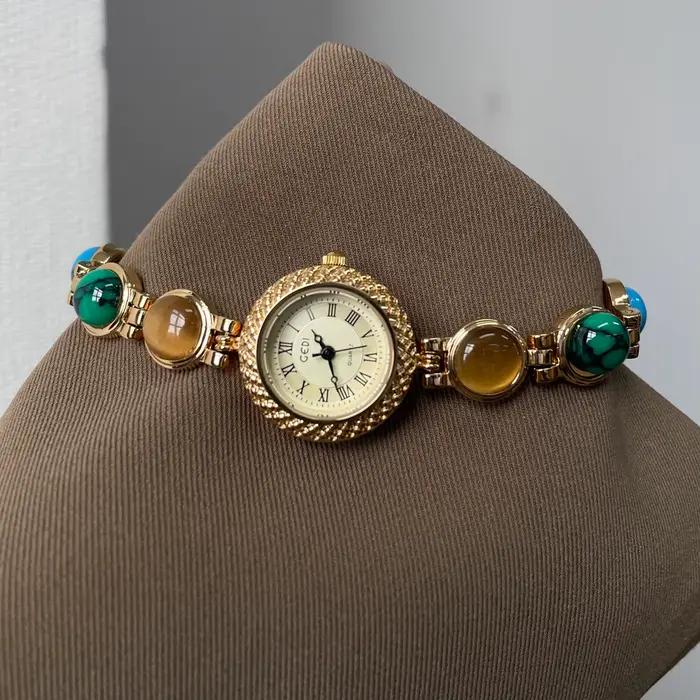 Montre dorée Doudou Design haut de gamme quartz résistante à l'eau pour femmes occasions spéciales élégante à offrir