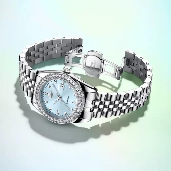 Montre à Quartz Luxe Femmes Planète Collection Calendrier Lumineux Bracelet Acier Occasions Spéciales Robuste et Élégante