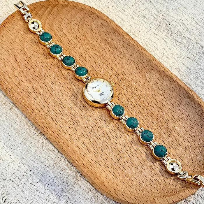 Montre-bracelet vintage pour femme ornée de pierres - Exquise