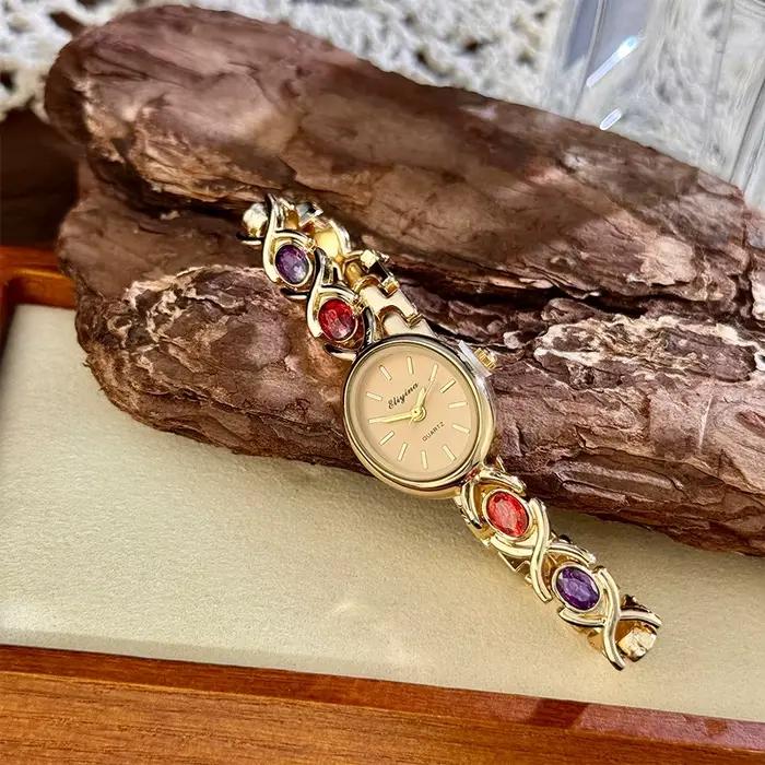 Montre exquise pour femme avec incrustation de pierres précieuses ovales et de diamants, montre comp